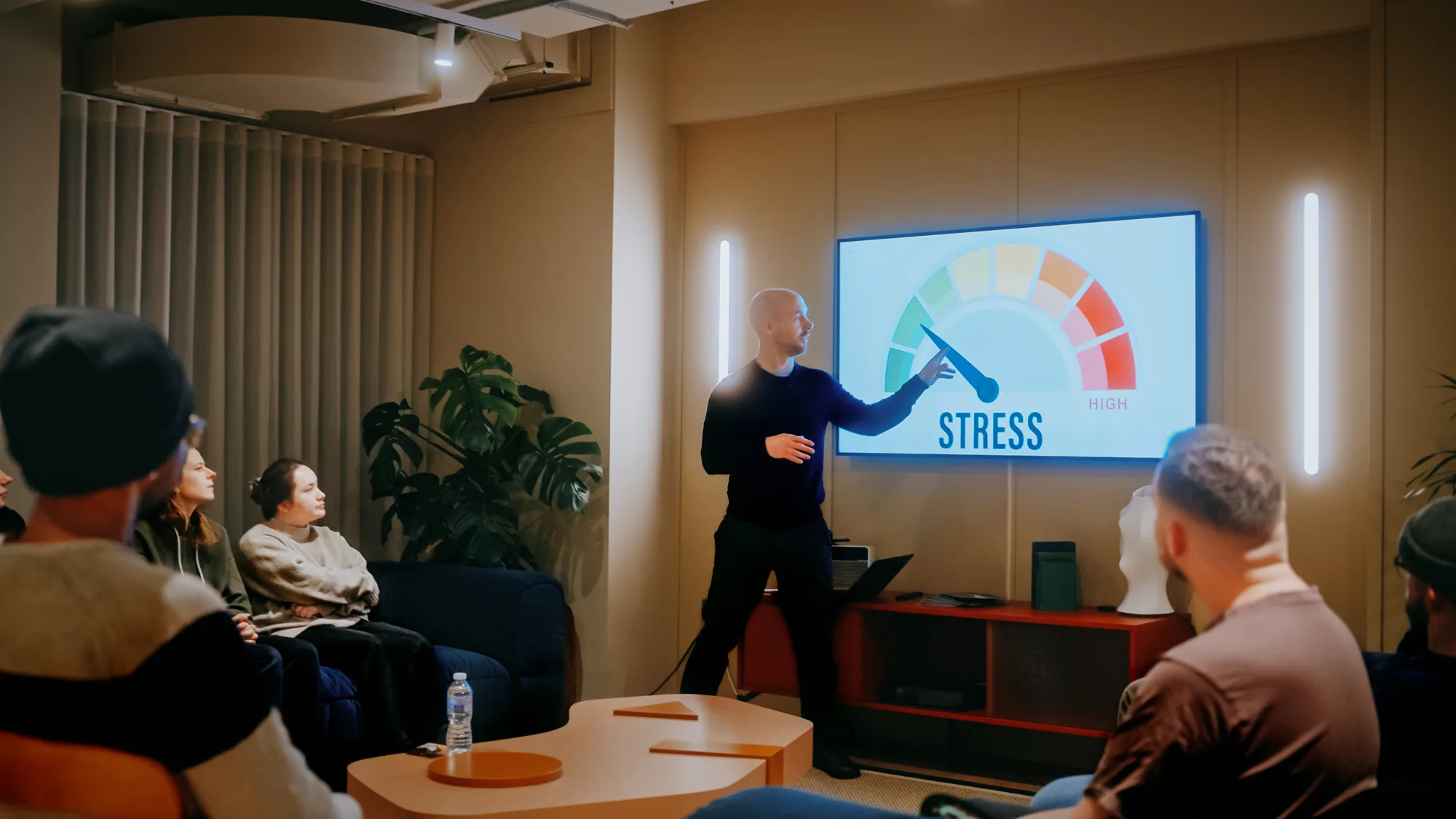 Paul Holmes pointing to a projected stress gauge during a workshop.